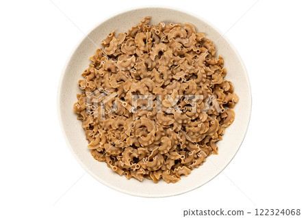 Raw paste in a bowl isolated on white background, italian food. Close-up view from the top. 122324068