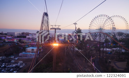 A view of the Ferris wheel and the Bandit against the evening sky from inside a gondola 122324091