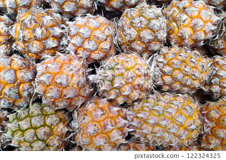 Stack of Phulae Pineapples on a market stall Stack of Phulae Pineapples on a market stall 122324325