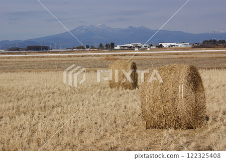 A landscape of rolls of grass with Mount Nasu in the background A landscape of rolls of grass with Mount Nasu in the background 122325408