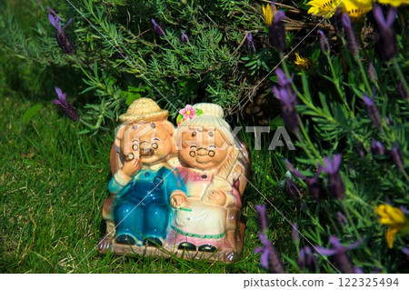 Old couple in the flower forest Old couple in the flower forest 122325494