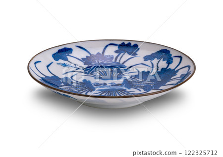 Closeup view of old blue pattern chinese ceramic plate isolated on white background. Closeup view of old blue pattern chinese ceramic plate isolated on white background. 122325712