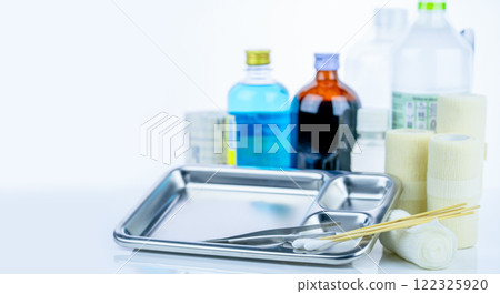 Medical equipment for treating infections. Wound care dressing set. Medical supplies for nurses. Conform bandage, forceps, cotton stick, alcohol. Sterile dressing materials. Healthcare equipment. 122325920