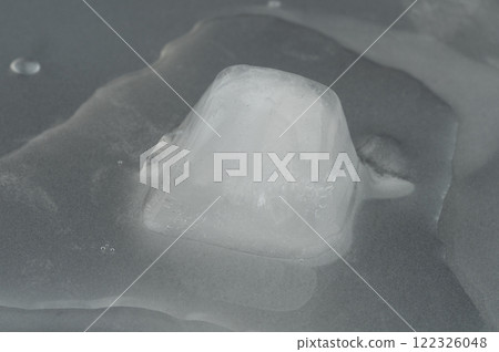 Melting ice cube 122326048