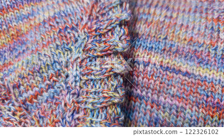 Knitted product from colored threads. Ready-made handmade women's sweater. 122326102