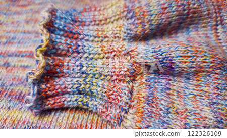 Knitted product from colored threads. Ready-made handmade women's sweater. Knitted product from colored threads. Ready-made handmade women's sweater. 122326109