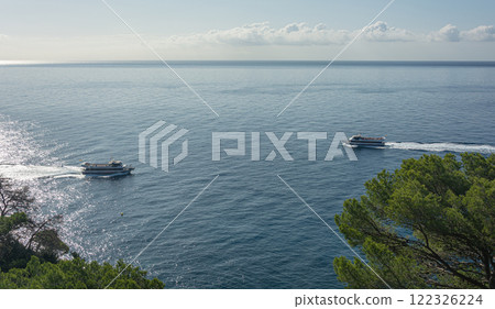 Lloret De Mar, Spain - 10/02/2019: Two pleasure craft on opposite courses 122326224