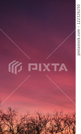 Red crimson and orange evening sky over the city. Fiery sunset. Red crimson and orange evening sky over the city. Fiery sunset. 122326250