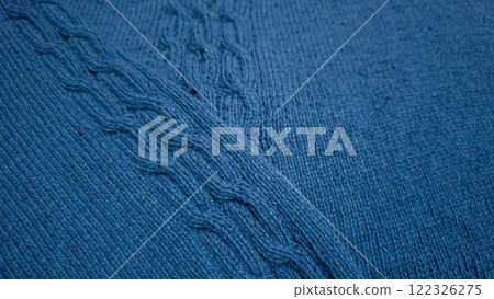Knitted product from blue threads. Ready-made handmade women's sweater. 122326275