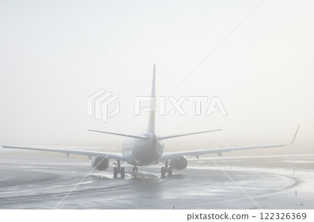 Plane taking off in the fog 122326369