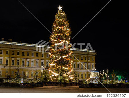 New Year's Petersburg. Christmas tree on Palace Square against the backdrop of the Winter Palace Hermitage in St. Petersburg on a winter night. New Year's Petersburg. Christmas tree on Palace Square against the backdrop of the Winter Palace Hermitage in St. Petersburg on a winter night. 122326507