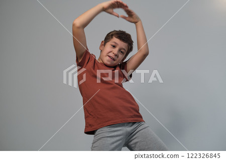 Arms raised, a light in his eyes; pure excitement. Captures the essence of experiential learning's impact. 122326845