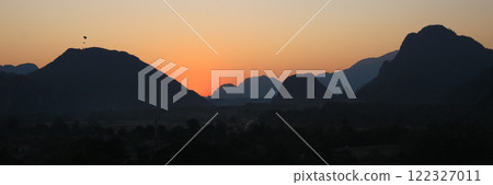Colorful evening sky over mountains at sunset, Vang Vieng, Laos. Colorful evening sky over mountains at sunset, Vang Vieng, Laos. 122327011