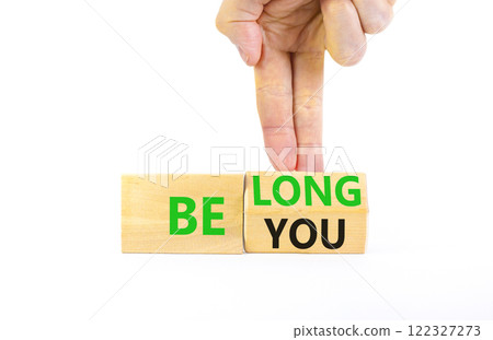 Belonging and belong symbol. Concept words Be you Belong on beautiful wooden block. Beautiful white background Businessman hand. Business motivational belonging and belong concept. Copy space. 122327273