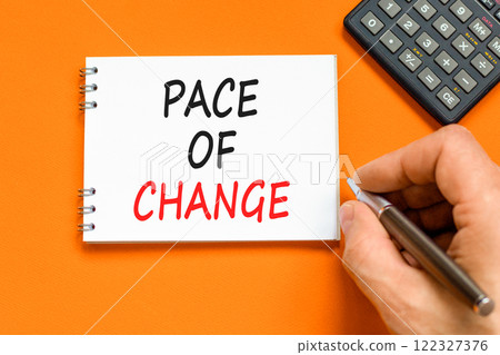 Pace of change symbol. Concept words Pace of change on beautiful white note. Beautiful orange background. Black pen. Businessman hand. Business pace of change concept. Copy space. Pace of change symbol. Concept words Pace of change on beautiful white note. Beautiful orange background. Black pen. Businessman hand. Business pace of change concept. Copy space. 122327376