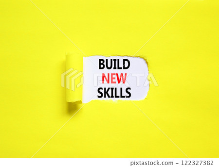 Build new skills symbol. Concept word Build new skills on beautiful white paper. Beautiful yellow table yellow background. Business, education build new skills concept. Copy space. Build new skills symbol. Concept word Build new skills on beautiful white paper. Beautiful yellow table yellow background. Business, education build new skills concept. Copy space. 122327382