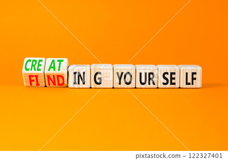 Finding or creating yourself symbol. Concept words Finding yourself or Creating yourself on beautiful wooden blocks. Beautiful orange background. Business creating yourself concept. Copy space. Finding or creating yourself symbol. Concept words Finding yourself or Creating yourself on beautiful wooden blocks. Beautiful orange background. Business creating yourself concept. Copy space. 122327401