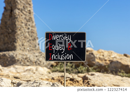 DEI diversity equity and inclusion symbol. Concept words DEI diversity equity and inclusion on blackboard. Beautiful stone background. Business DEI diversity equity and inclusion concept. Copy space. DEI diversity equity and inclusion symbol. Concept words DEI diversity equity and inclusion on blackboard. Beautiful stone background. Business DEI diversity equity and inclusion concept. Copy space. 122327414