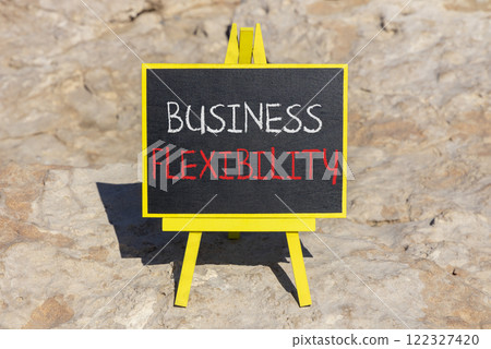 Business flexibility symbol. Concept words Business flexibility on beautiful yellow blackboard. Beautiful red stone beach background. Business flexibility concept. Copy space. 122327420