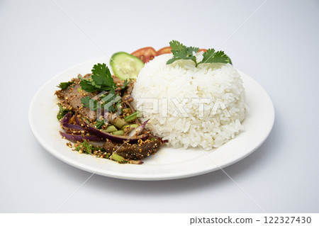 Grilled pork neck rice salad, Thai street food, placed on a white background. 122327430
