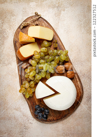 Georgian cheese, Imeretian and smoked suluguni, grapes, nuts, on a cutting board, Georgian cuisine, no people, Georgian cheese, Imeretian and smoked suluguni, grapes, nuts, on a cutting board, Georgian cuisine, no people, 122327512