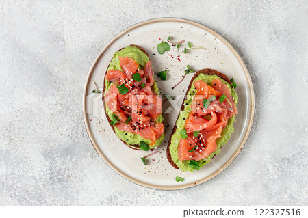 breakfast, Sandwiches with smoked salmon and avocado, on dark rye bread, with microgreens, on a marble table, homemade, no people, 122327516