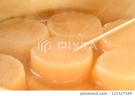 Stick a skewer into boiled radish Stick a skewer into boiled radish 122327544
