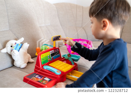 A child is playing store. A child is playing store. 122328712