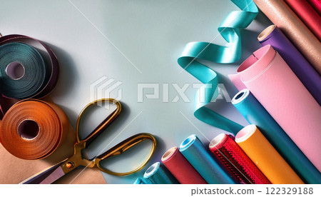 Creative workspace with various wrapping materials, including scissors, ribbons, and colorful rolls. Perfect for crafting and gift wrapping projects Creative workspace with various wrapping materials, including scissors, ribbons, and colorful rolls. Perfect for crafting and gift wrapping projects 122329188