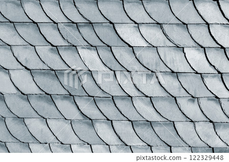 Detail close-up of natural grey stone shingle slate tiles texture roof abstract surface background. Natural mineral material dark rock plate building wall exterior design backdrop 122329448