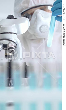 Scientist examining sample in laboratory Scientist examining sample in laboratory 122329753