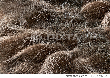 Dried Grass Surface with Organic Brown Tones as a Background Dried Grass Surface with Organic Brown Tones as a Background 122329784