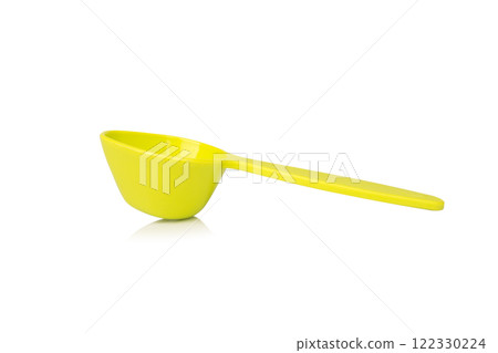 Green measuring spoon isolated on white background Green measuring spoon isolated on white background 122330224
