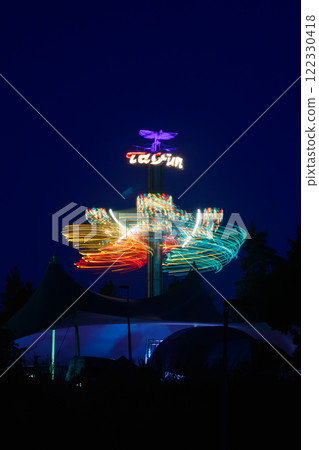 Kouvola, Finland - 26 August 2023: Rotating ride Taifun in amusement park Tykkimaki at night 122330418