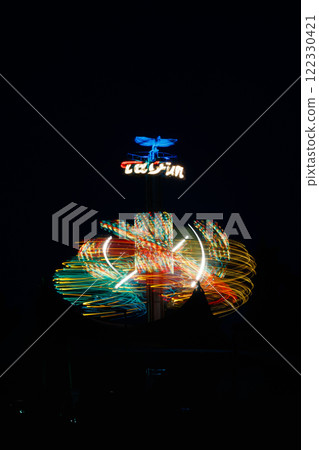 Kouvola, Finland - 26 August 2023: Rotating ride Taifun in amusement park Tykkimaki at night 122330421