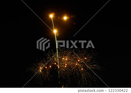 Colorful fireworks lights on the night sky background 122330422
