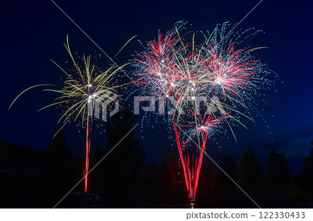 Colorful fireworks lights on the night sky background 122330433