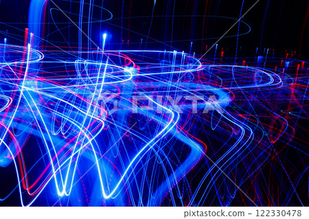 Abstract blurred colorful light effect on a black background. Long exposure photo of moving camera. 122330478