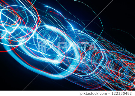 Abstract blurred colorful light effect on a black background. Long exposure photo of moving camera. 122330492