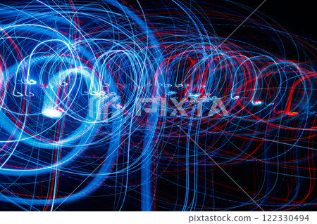 Abstract blurred colorful light effect on a black background. Long exposure photo of moving camera. 122330494