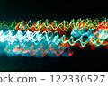 Abstract blurred colorful light effect on a black background. Long exposure photo of moving camera. 122330527
