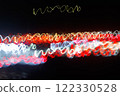 Abstract blurred colorful light effect on a black background. Long exposure photo of moving camera. 122330528