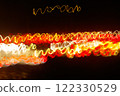 Abstract blurred colorful light effect on a black background. Long exposure photo of moving camera. 122330529