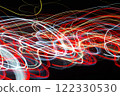 Abstract blurred colorful light effect on a black background. Long exposure photo of moving camera. 122330530