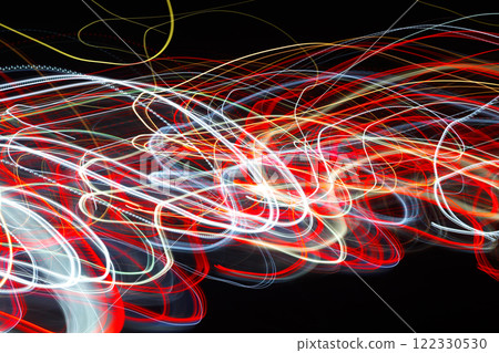Abstract blurred colorful light effect on a black background. Long exposure photo of moving camera. 122330530