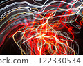 Abstract blurred colorful light effect on a black background. Long exposure photo of moving camera. 122330534