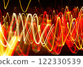Abstract blurred colorful light effect on a black background. Long exposure photo of moving camera. 122330539