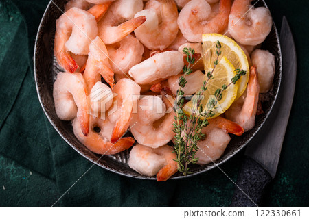 Frozen uncooked prawns or shrimps with lemon 122330661