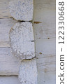 A corner of an old house made of wood 122330668