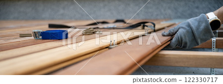 Woodworking in progress: Securing wooden planks Woodworking in progress: Securing wooden planks 122330717